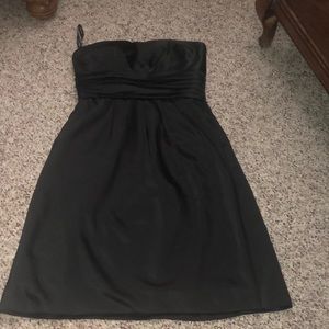 Strapless black dress with pockets